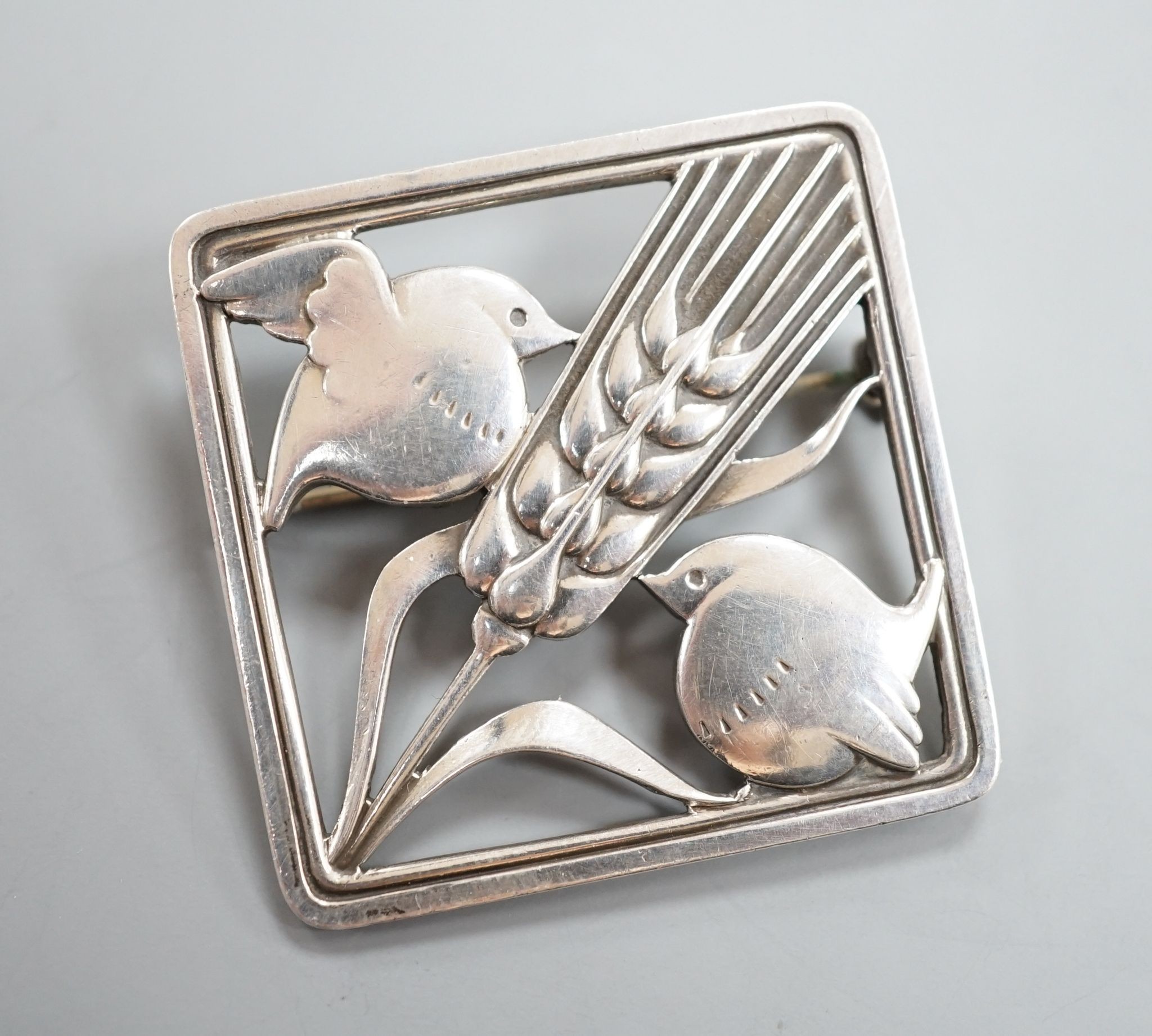 A Georg Jensen sterling 'Two birds with ear of wheat' brooch, no. 250, 38mm.